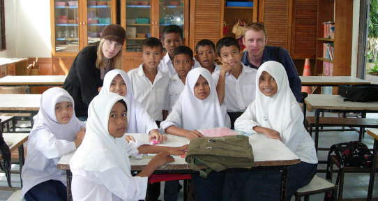 Nicole Sorochan and Chandler Vandergrift with Muslim School children in Thailand. Nicole and Chandler raised funds to shoot a documentary film in Southern Thailand.